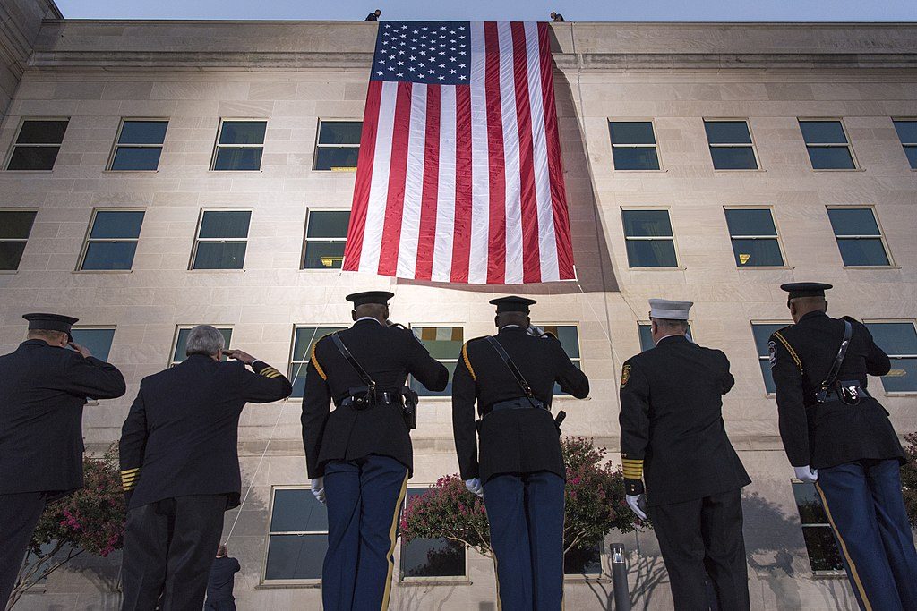 soldiers salute the us flag