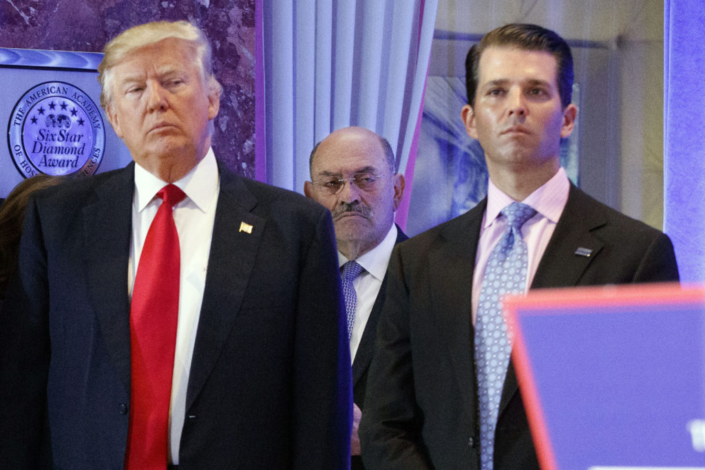 Allen Weisselberg, flanked by Donald Trump and Donald Trump Jr.