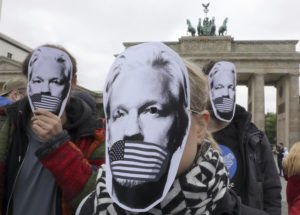 Pro-Assange protesters in front of the Brandenburg Gate in Berlin.