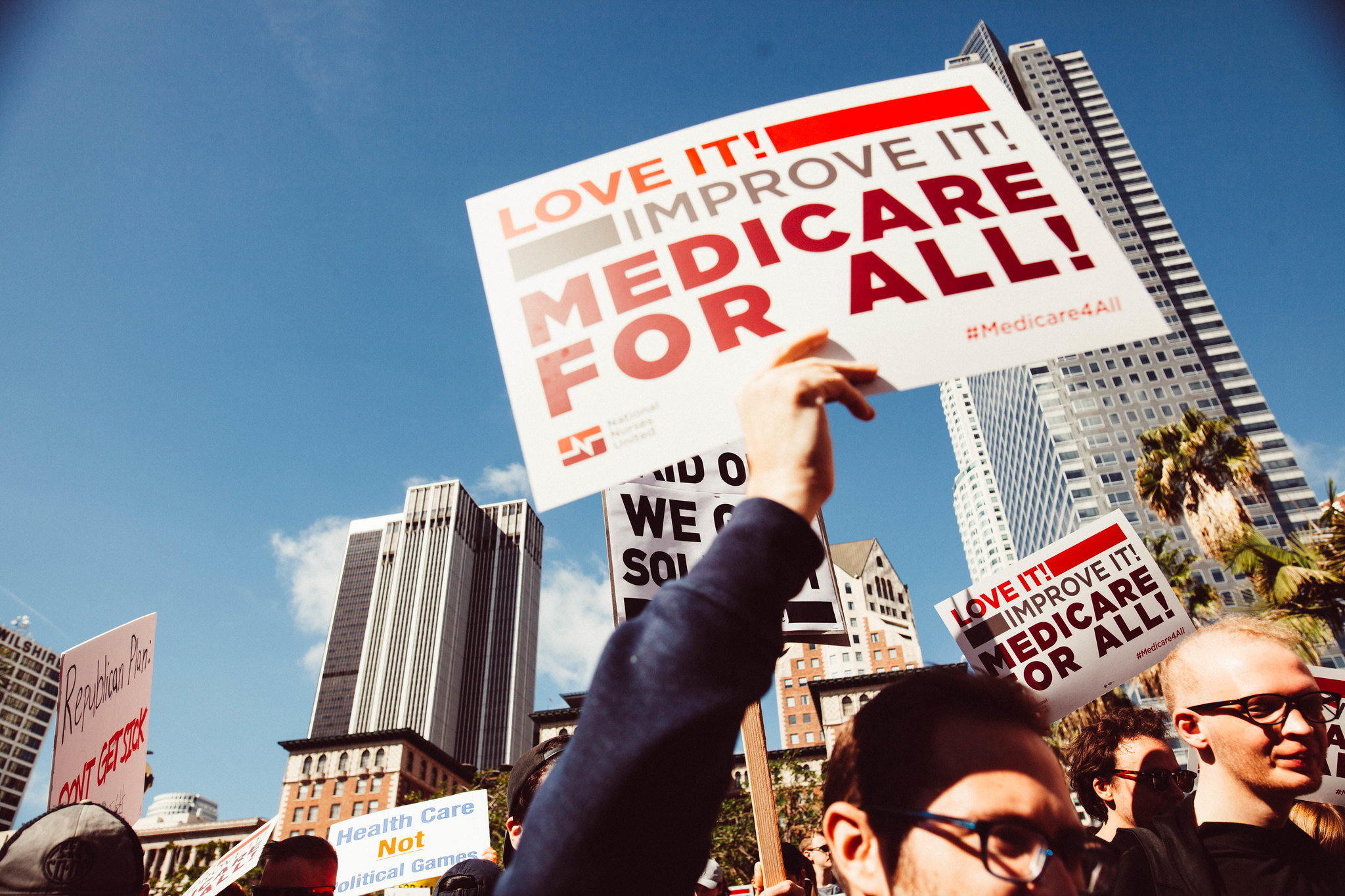 medicare for all sign at a protest