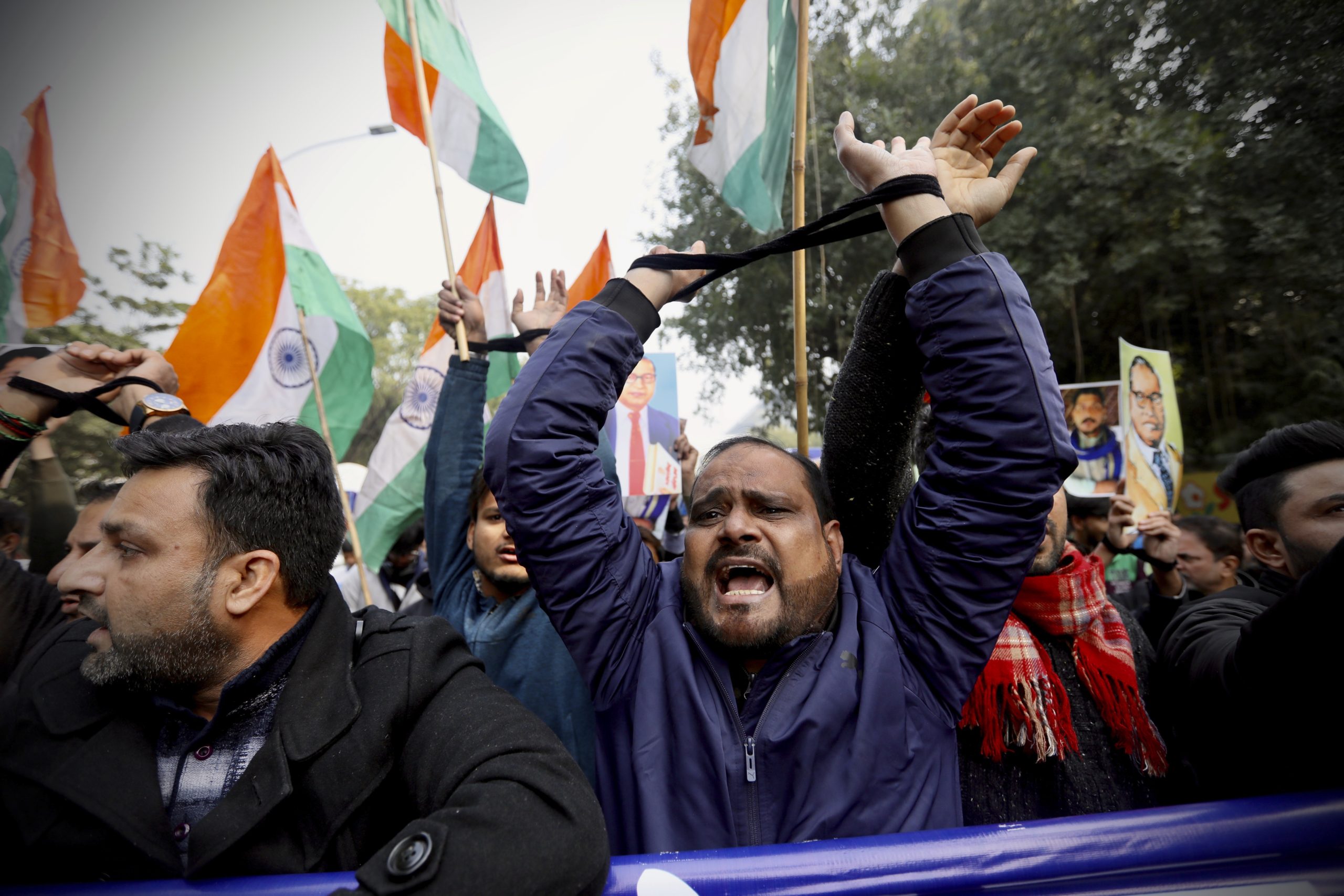 Indian raise their tied hands in protest against the Citizenship Amendment Act in New Delhi, India, this week.
