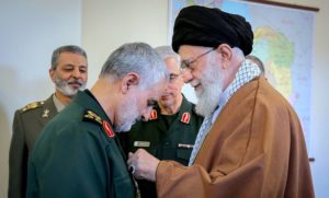 Iran's Qasem Soleimani receiving an award from the Ayatollah.