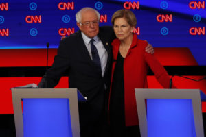 Sen. Bernie Sanders, I-Vt., and Sen. Elizabeth Warren, D-Mass., embrace after a primary debate in Detroit, MI, last July.