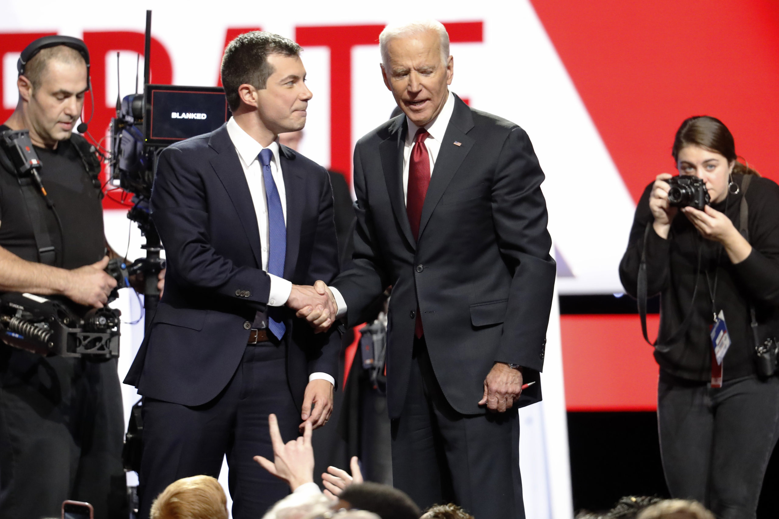 Pete Buttigieg shakes hands with Joe Biden.