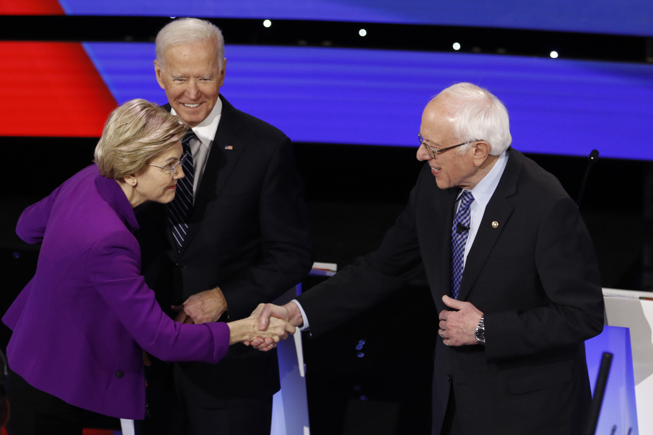 Sen. Elizabeth Warren, D-Mass., and Sen. Bernie Sanders, I-Vt., shake hands before the Democratic debate Tuesday.