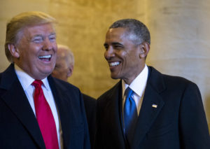 Donald Trump and Barack Obama laughing together.