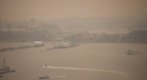 View through the haze from Sydney Harbour Bridge as Australia's bushfires rage on.