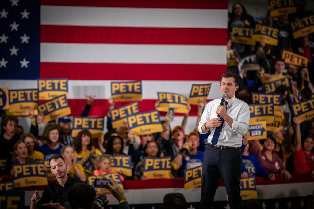 Pete Buttigieg leads a rally at Lincoln High School in Des Moines, IA, on Sunday.