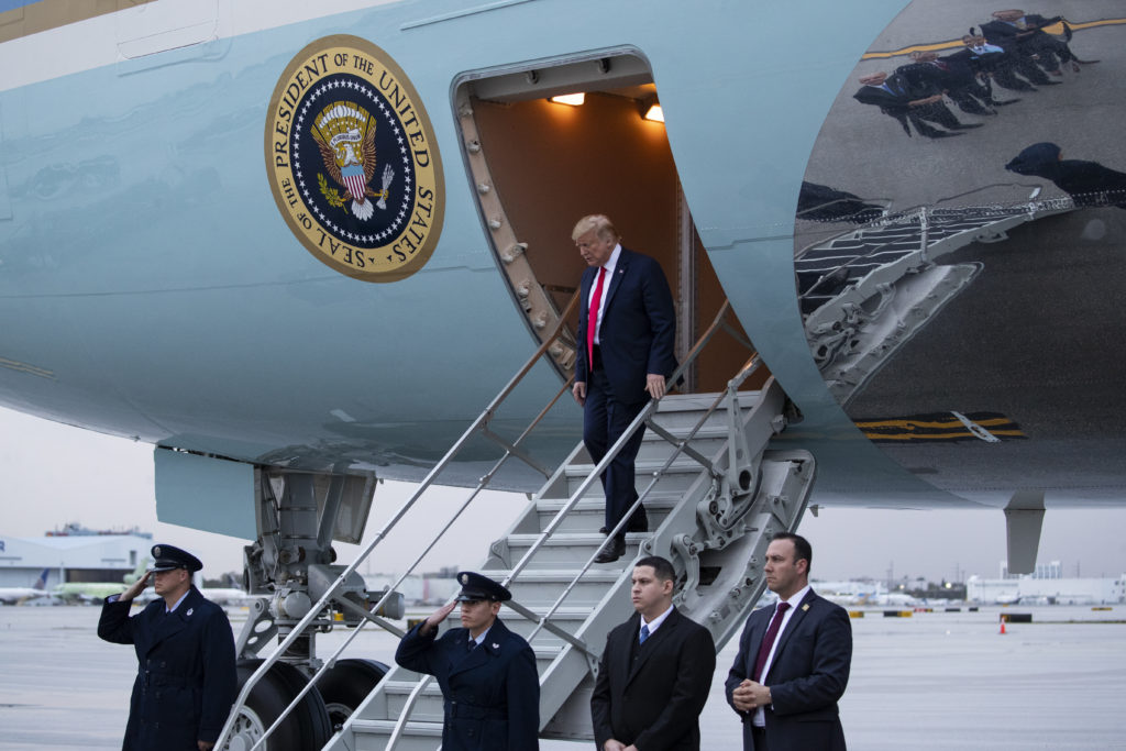 President Donald Trump arrives at Miami International Airport to attend the Republican National Committee winter meetings last month.