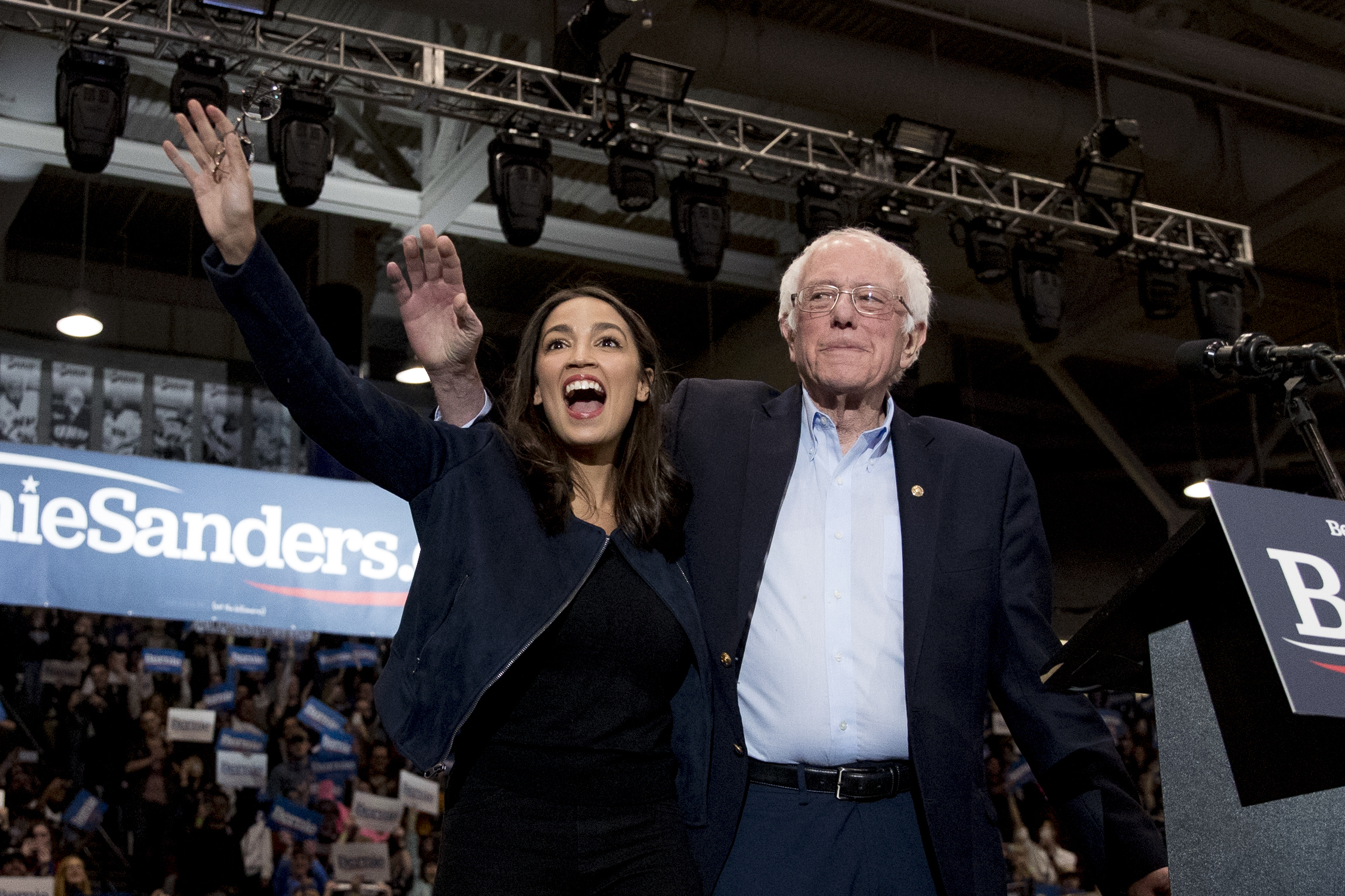 Sen. Bernie Sanders, I-Vt., is accompanied by Rep. Alexandria Ocasio-Cortez, D-N.Y., left, at the University of New Hampshire in Durham, N.H.