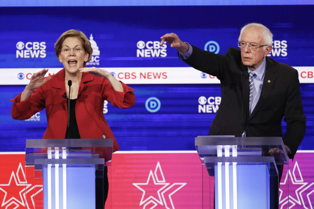 Sen. Elizabeth Warren, D-Mass., left, and Sen. Bernie Sanders, I-Vt., right, debate in Charleston, S.C., Tuesday.