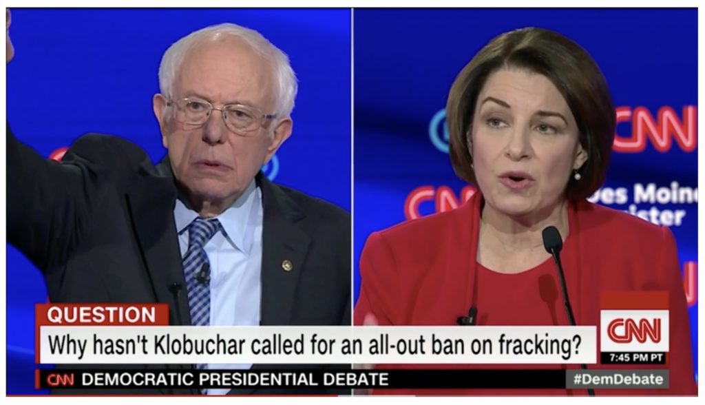 Sens. Bernie Sanders and Amy Klobuchar appear at a January 2020 debate