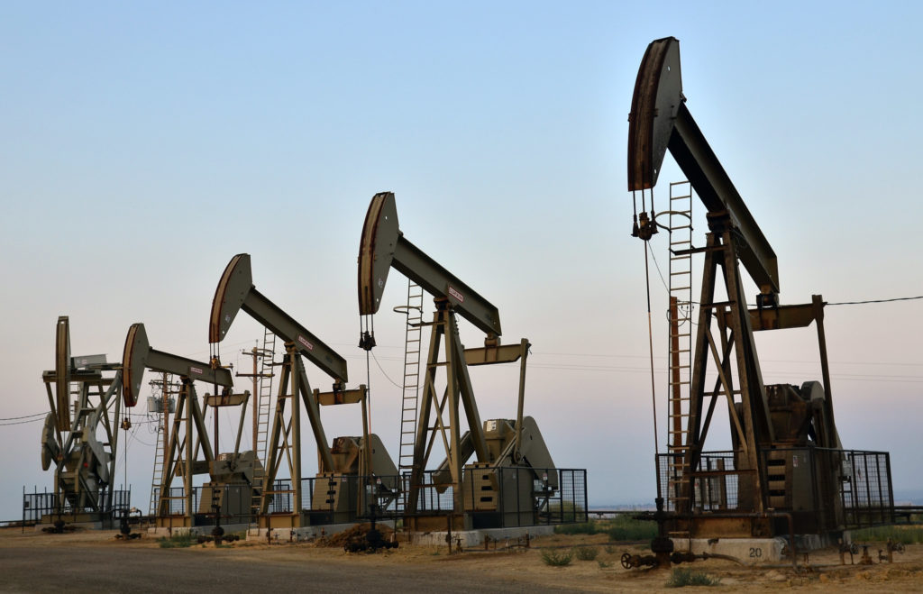 Five drilling rigs on a field