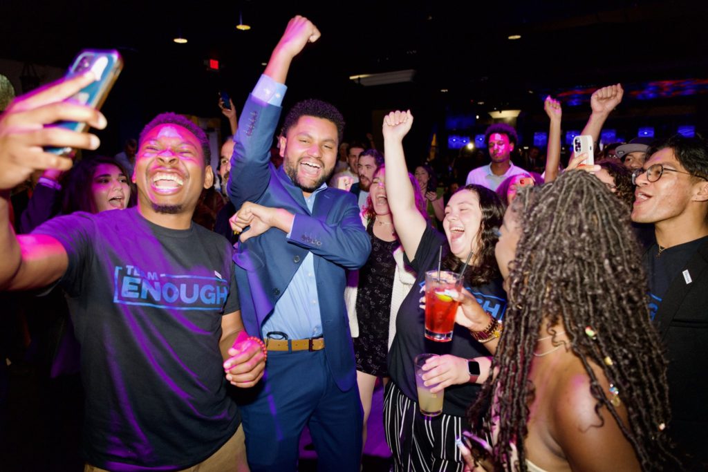 A group of onlookers celebrate.