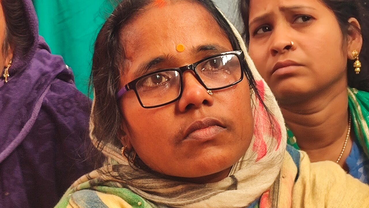 Geeta Devi complains of domestic abuse to her friends in a temple, January, 2023.